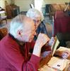 Homestead Estates Home Plus residents reading birthday cards